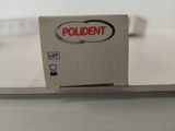 a sign that says poldent on it sitting on a table