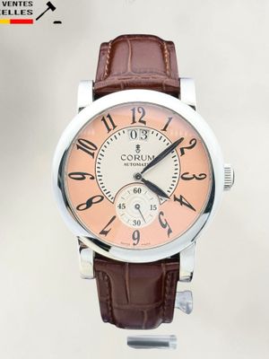 a close up of a wrist watch with a brown leather strap