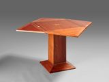 a close up of a wooden table with a wooden top