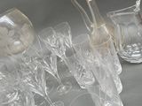 a lot of glasses and a pitcher on the table