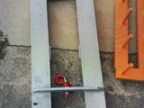 two pieces of metal on the side of a building