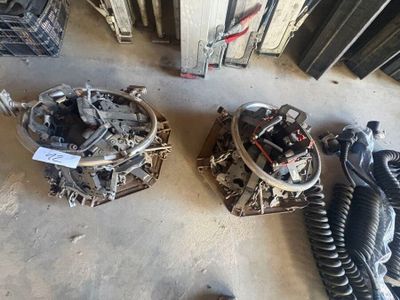 two different types of electrical equipment sitting on the floor