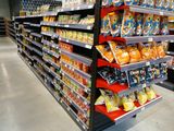 a lot of snacks on the shelves in the store