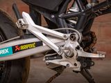 a close up of a motorcycle with a chain attached to it