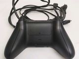 a close up of a video game controller on a table