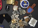 a lot of badges and badges on a table