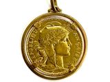 an image of a gold coin with a woman ' s face on it