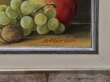 a painting of grapes and an apple on a table