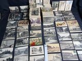a lot of old postcards sitting on a table