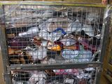 a large metal cage filled with lots of items
