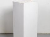 an image of a white box sitting on top of a cement floor