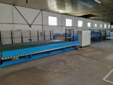 an image of a factory with a conveyor belt in the middle of it
