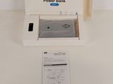 a box with a power bank inside of it on a table