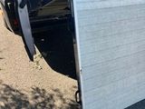 an image of a truck with a ramp attached to the back of it