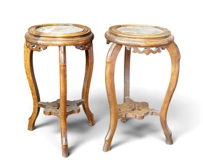 pair of carved wood side tables with marble tops