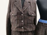 a mannequin and a suit on a mannequin stand
