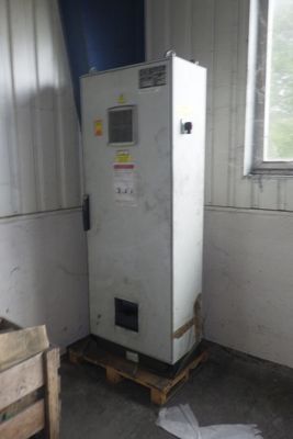 a white refrigerator sitting in a room next to a window