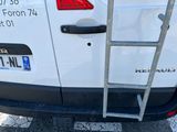 a ladder attached to the back of a white van