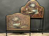 pair of painted headboards with candles on them on a wooden floor
