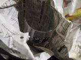 a pile of newspapers sitting on top of a table