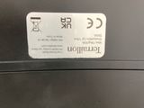 the back of a black laptop with a sticker on it