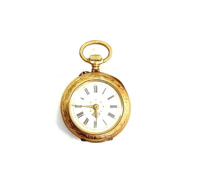 une montre de poche en or avec des chiffres romains