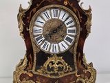 a clock that is sitting on top of a table