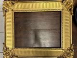 a picture of a picture frame on a table with a clock