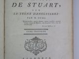 an open book with a picture of a coat of arms and a coat of arms on top of it