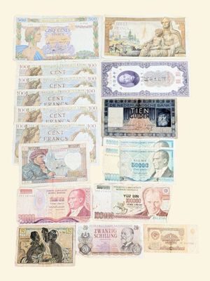 a lot of different bank notes on the table