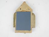 a picture of a small mirror on a wall