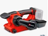 un outil électrique rouge et noir muni d'une batterie