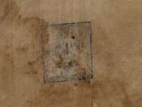 a picture of a piece of brown paper with a square on it