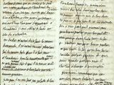 un vieux livre sur lequel il y a des inscriptions et une ligne tracée au milieu