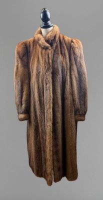 a close up of a fur coat on a mannequin mannequin