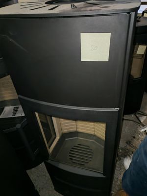 a black stove with a white label on it