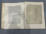 an open book with a drawing of a man ' s face on it