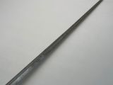 a close up of a knife on a table with a white background