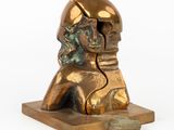bronze statue of a man with a helmet on his head