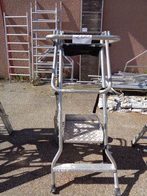 an image of a ladder and a chair in a yard