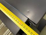 a measuring tape on the edge of a table