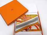 an orange box with a pair of socks in it sitting on a table