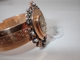 a close up of a wrist watch on a table
