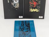 two books are sitting on a white surface one is blue and the other is black
