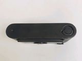 an image of a close up of a black object on a white surface