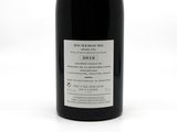 a bottle of wine that is sitting on a table