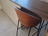 a kitchen with a table and chairs in it