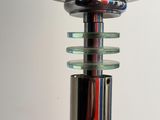 an image of a close up of a lamp with a metal base