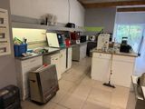 an image of a kitchen with a lot of clutter