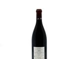 a bottle of wine that is sitting on a table